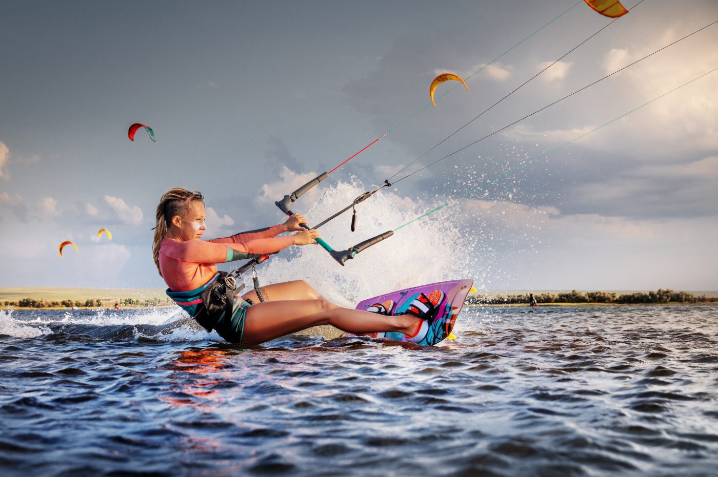 a girl practicing kitesurfing