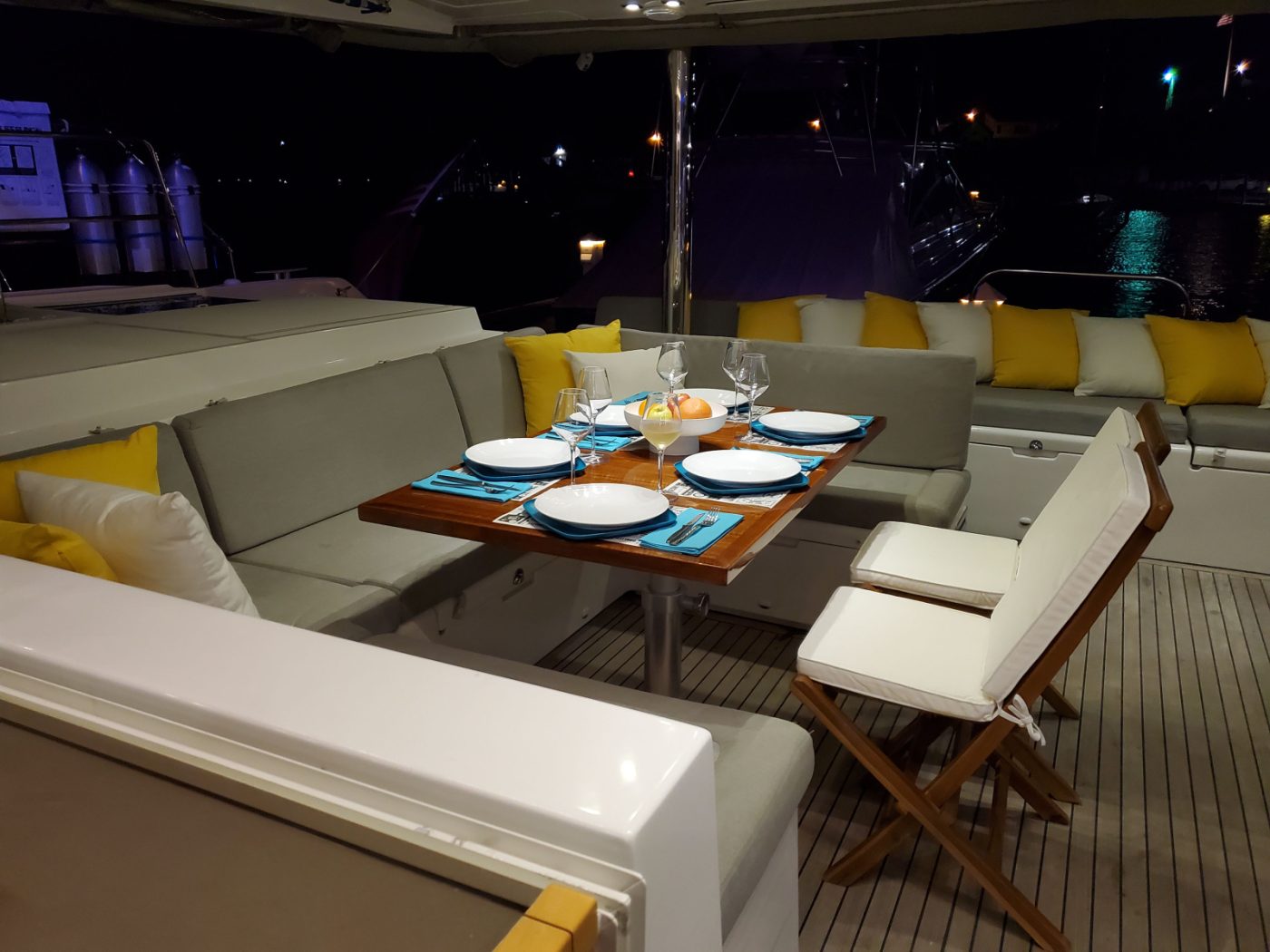 Private Luxury Catamaran Charter Exumas Bahamas cockpit-table-night